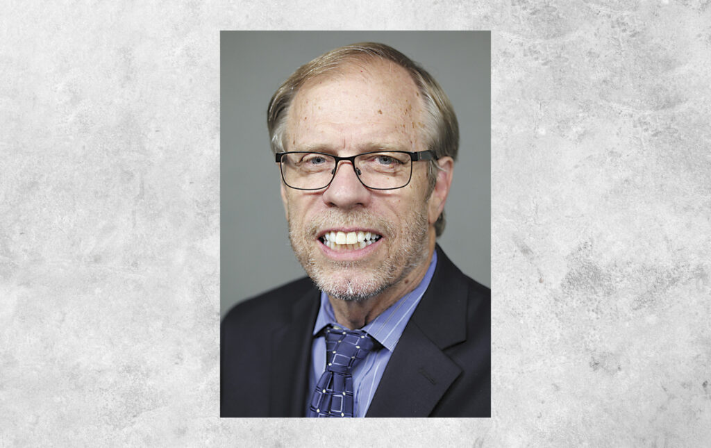 erlandson-w-background-scaled.jpg